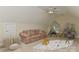 playroom/bedroom featuring cozy floral sofa, teepee, and neutral carpet for hours of imaginative fun at 1090 Heather Glen Dr, Matthews, NC 28104