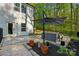 Backyard patio with stone pavers, a seating area, and lush landscaping for outdoor enjoyment at 11040 E Lake Rd, Charlotte, NC 28215