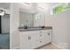 Bright bathroom features double vanity with granite countertops, offering a functional and stylish space at 11040 E Lake Rd, Charlotte, NC 28215