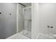 Sleek bathroom featuring tiled walk-in shower with glass enclosure, perfect for a modern aesthetic at 11040 E Lake Rd, Charlotte, NC 28215