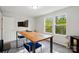 Bedroom featuring desk with bright windows and natural light, perfect for a productive workspace at 11040 E Lake Rd, Charlotte, NC 28215