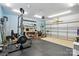 Spacious garage featuring a workout area, ample storage, and a durable black rubber floor at 11040 E Lake Rd, Charlotte, NC 28215