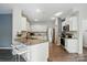 Modern kitchen with stainless steel appliances, granite countertops, and white cabinets at 11040 E Lake Rd, Charlotte, NC 28215