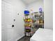 Well-stocked pantry with ample shelving, storage space, and a freezer for organized food storage at 11040 E Lake Rd, Charlotte, NC 28215