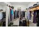 Organized walk-in closet with ample hanging space and shelving, providing efficient storage solutions at 11040 E Lake Rd, Charlotte, NC 28215