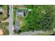 An aerial view of a property with a parking lot, greenery, and an outline of the parcel boundaries at 115 12Th Sw St, Hickory, NC 28602