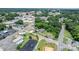 Aerial view of brick home nestled among trees in a neighborhood setting at 115 12Th Sw St, Hickory, NC 28602