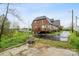 Expansive backyard with a patio, deck, and lush greenery, providing ample outdoor space at 115 12Th Sw St, Hickory, NC 28602