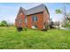 Large, grassy backyard offering plenty of space, bordered by trees, with a home at 115 12Th Sw St, Hickory, NC 28602