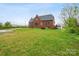 Sprawling lawn and home exterior, landscaped yard provides privacy and outdoor enjoyment at 115 12Th Sw St, Hickory, NC 28602