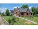 Brick home exterior with pathway showcasing the property's accessibility and curb appeal at 115 12Th Sw St, Hickory, NC 28602