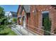 Detail of home's brick exterior with ramp, showing unique architectural features and accessibility at 115 12Th Sw St, Hickory, NC 28602