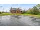 Classic brick home, showcasing a large paved parking area at 115 12Th Sw St, Hickory, NC 28602