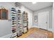 Hallway with hardwood floors, unique decor, and access to multiple rooms at 115 12Th Sw St, Hickory, NC 28602