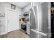 Updated kitchen featuring stainless steel appliances, sleek gray cabinets, and stylish hardware with wood-look flooring at 115 12Th Sw St, Hickory, NC 28602