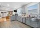 Modern kitchen features gray cabinets, stainless steel appliances, light countertops, and wood-look flooring at 115 12Th Sw St, Hickory, NC 28602