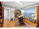 Well-lit office space with hardwood floors, built-in bookshelves, and large windows at 115 12Th Sw St, Hickory, NC 28602