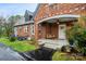 Charming covered porch with a swing, enhancing the home's curb appeal at 115 12Th Sw St, Hickory, NC 28602
