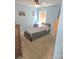 Cozy bedroom features a ceiling fan and a picture window at 119 W Maranta Rd, Mooresville, NC 28117