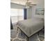 Bright bedroom with natural light, a ceiling fan, and minimalist decor at 119 W Maranta Rd, Mooresville, NC 28117