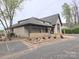 Charming clubhouse with stone accents and covered entry; professionally landscaped for curb appeal at 119 W Maranta Rd, Mooresville, NC 28117