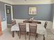 Cozy dining room features neutral carpet and traditional furnishings at 119 W Maranta Rd, Mooresville, NC 28117