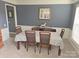 Dining area features an oversized table with seating for six people at 119 W Maranta Rd, Mooresville, NC 28117