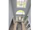 Bright foyer features a chandelier, skylights and transom window above the front door, welcoming you into a stylish home at 119 W Maranta Rd, Mooresville, NC 28117