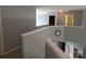 Upstairs hallway featuring neutral paint and doors leading to bedrooms and bathrooms at 119 W Maranta Rd, Mooresville, NC 28117
