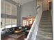 Spacious living room with a high ceiling, large windows and a gray sectional sofa at 119 W Maranta Rd, Mooresville, NC 28117