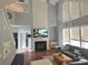 Spacious living room with a fireplace, large windows, hardwood floors and lots of light at 119 W Maranta Rd, Mooresville, NC 28117