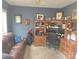 Functional office space featuring a large desk, shelving, and comfortable seating at 119 W Maranta Rd, Mooresville, NC 28117