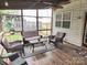 Cozy screened porch features comfortable seating, a ceiling fan, and an inviting space for enjoying the outdoors at 119 W Maranta Rd, Mooresville, NC 28117