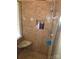 Tiled shower with a corner seat and built-in shelving for toiletries at 119 W Maranta Rd, Mooresville, NC 28117