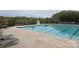 Large community pool with ample seating, perfect for summer relaxation and recreation at 119 W Maranta Rd, Mooresville, NC 28117