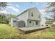 Backyard featuring a gray home and a stone patio with a gray shed at 1213 Salvadore Ct, Gastonia, NC 28052
