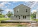 Backyard featuring a gray home and a stone patio at 1213 Salvadore Ct, Gastonia, NC 28052