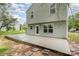 Backyard featuring a gray home and a stone patio at 1213 Salvadore Ct, Gastonia, NC 28052