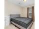 This bedroom offers a gray bed and neutral carpet and walls at 1213 Salvadore Ct, Gastonia, NC 28052