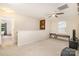 This is a bonus room with a ceiling fan, tv, and neutral walls and carpet at 1213 Salvadore Ct, Gastonia, NC 28052
