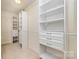 Walk-in closet with built-in shelving and drawers for organized storage at 1213 Salvadore Ct, Gastonia, NC 28052
