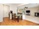 Open dining area leads to a cozy living space, complemented by a modern glass table and stylish decor at 1213 Salvadore Ct, Gastonia, NC 28052