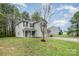 Inviting two-story home with lush greenery and a well-maintained lawn, creating a peaceful outdoor space at 1213 Salvadore Ct, Gastonia, NC 28052