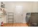 Laundry room featuring a washer and dryer and storage shelving at 1213 Salvadore Ct, Gastonia, NC 28052