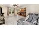 Open-concept living room seamlessly connects with kitchen, featuring modern flooring and ample natural light at 1213 Salvadore Ct, Gastonia, NC 28052