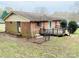Back exterior with a small deck and fenced in yard at 124 Riley Rd, Dallas, NC 28034