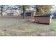 Spacious backyard featuring a storage shed and chain link fence at 124 Riley Rd, Dallas, NC 28034