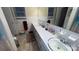 Bright bathroom with a long vanity, dual sinks, and decorative mirror at 124 Riley Rd, Dallas, NC 28034