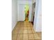 Hallway with tile flooring leads to the laundry room with white appliances and bead board at 124 Riley Rd, Dallas, NC 28034