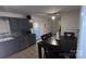 This eat-in kitchen is has gray cabinets, a tile backsplash, and stainless appliances at 124 Riley Rd, Dallas, NC 28034